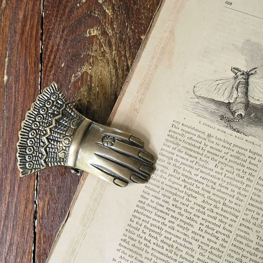Handclip aus goldfarbenem Messing